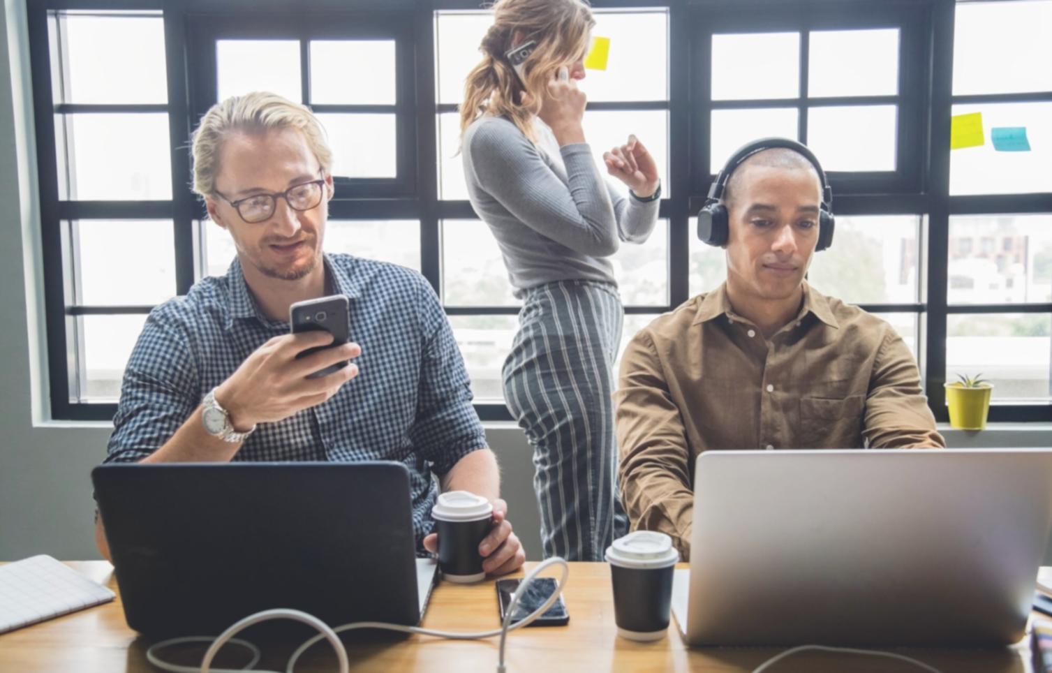 Professional financial consultation meeting showing investment planning documents and analysis tools